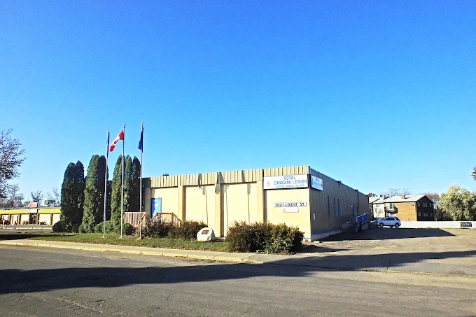 The Royal Canadian Legion Branch 362 building at 3021 Louise St, Saskatoon, with Canadian and Legion flags flying out front — home of Bridge City Cornhole league nights